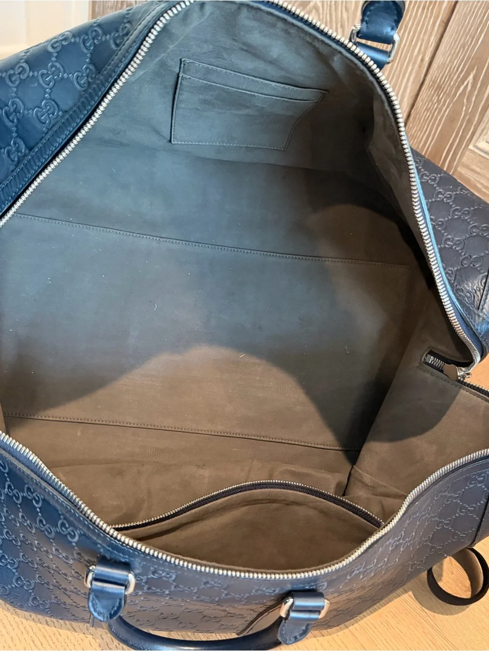 Gucci Navy Embossed GG Leather Duffel Bag